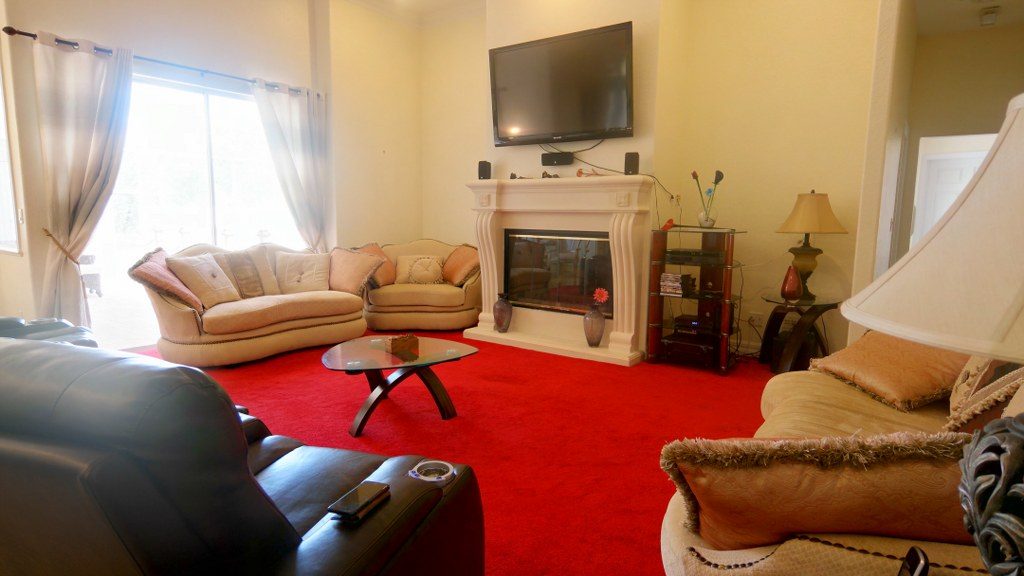 Lounge with soft seating arranged around the fireplace