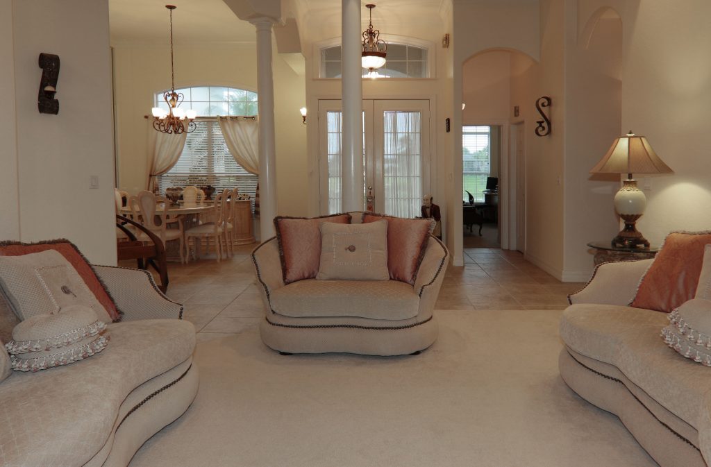 Bright shared living room with large windows