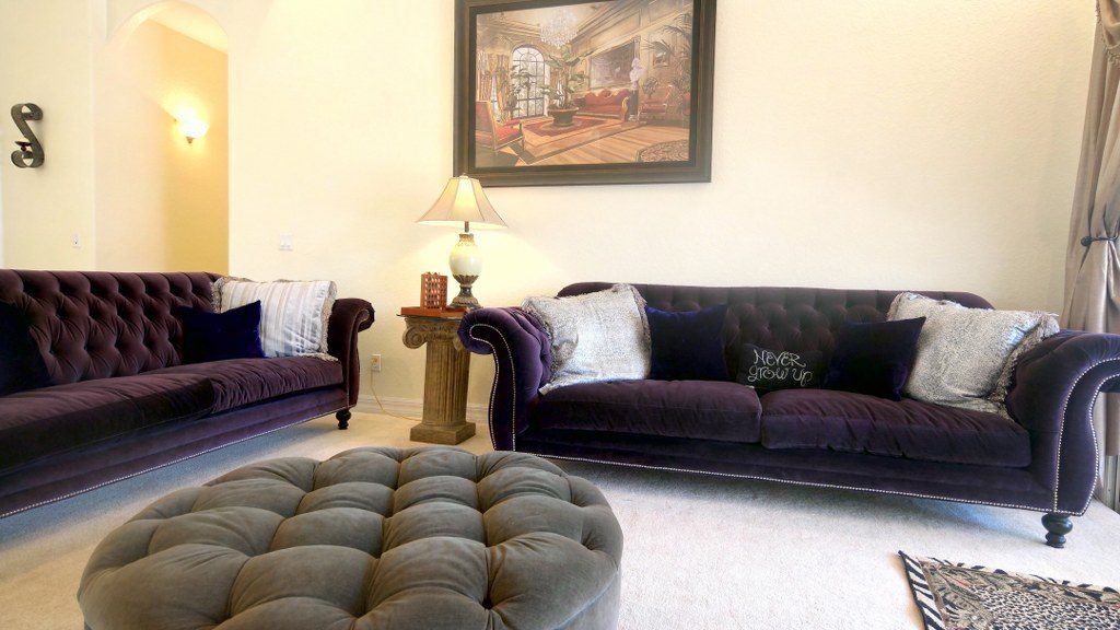 Lounge with plush purple seating